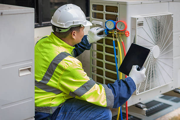 Professional Heat Pump Repair technician working in Brownsboro, AL